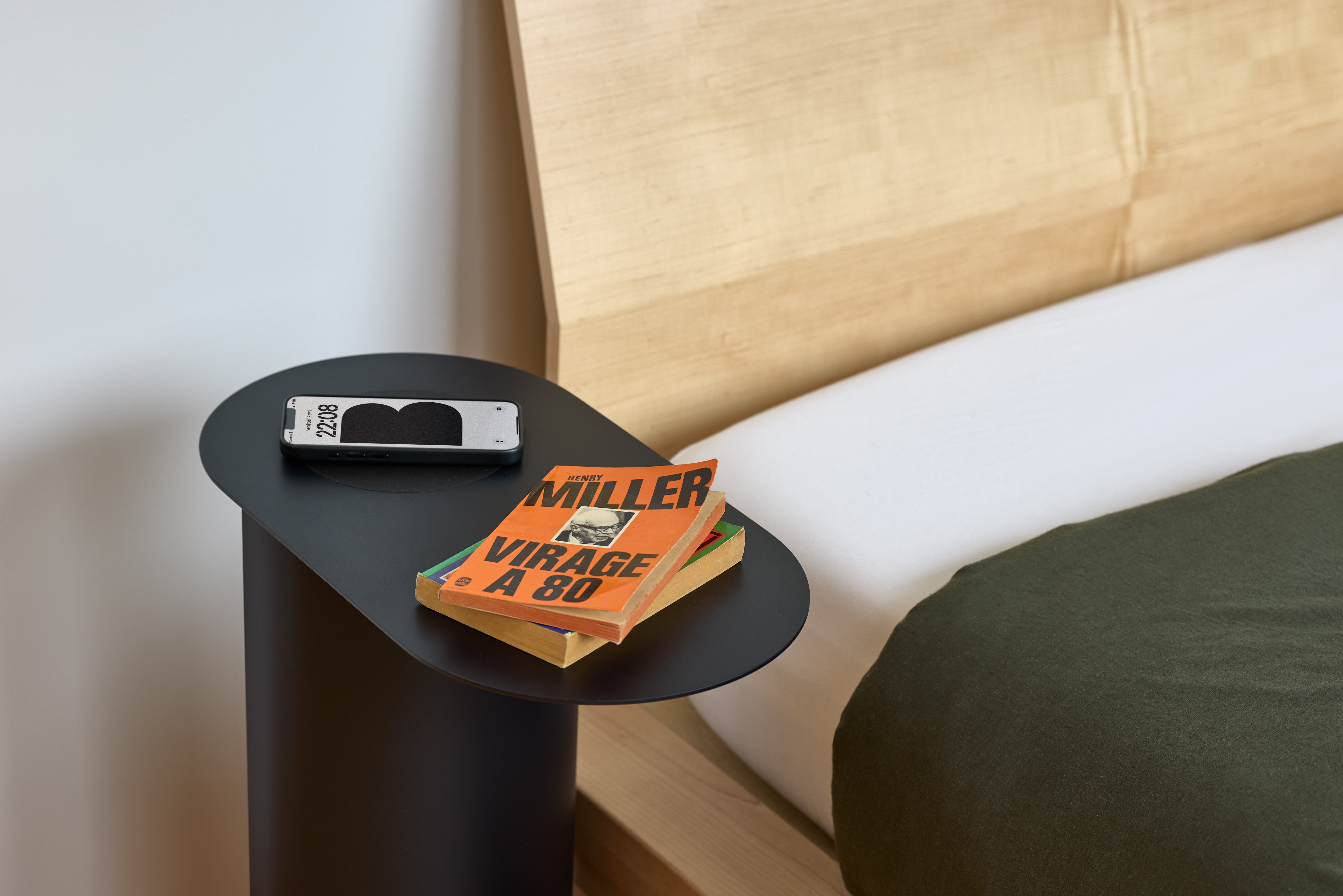 Qi2 iPhone charger with Adap Beside Table